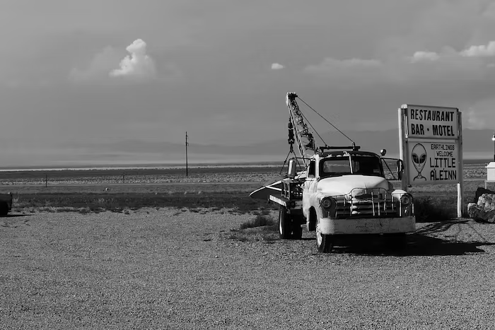 a tow truck by the beach