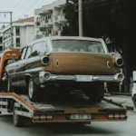 a car loaded on a flatbed tow truck