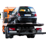 A tow truck carrying a car