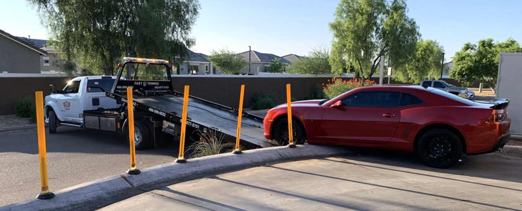 a car being towed on a flatbed.
