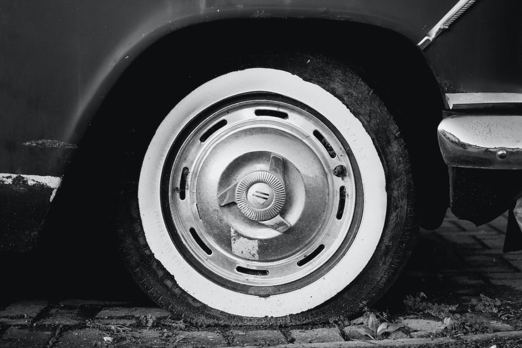 A closeup image of a car with a flat tire